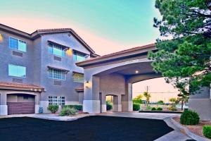 a house with a driveway and a garage at Comfort Inn & Suites Sierra Vista near Ft Huachuca in Sierra Vista
