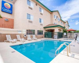 a hotel with a swimming pool in front of a building at Comfort Inn & Suites Sierra Vista near Ft Huachuca in Sierra Vista