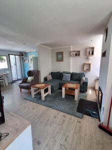 a living room with a couch and a table at Domki Spore in Spore