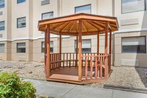 a wooden gazebo in front of a building at Quality Inn Knoxville West Cedar Bluff in Knoxville