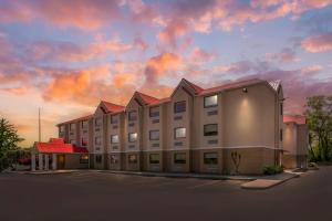 a rendering of a hotel with a cloudy sky at Quality Inn Knoxville West Cedar Bluff in Knoxville