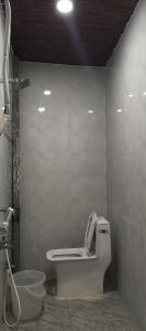 a bathroom with a toilet and a sink at HoTEL SRI DURGA GRAND in Vijayawāda +20 photos
