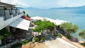 an aerial view of a hotel next to the water at ARTEMIS ROOMS in Pefki