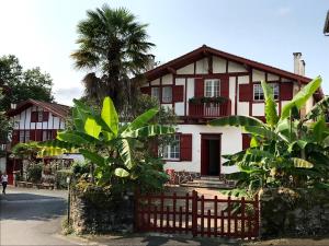 a house with a fence in front of it at Etche alabena - 2 in Ainhoa