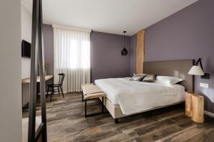 Säng eller sängar i ett rum på Locanda la Cross - Adults Only