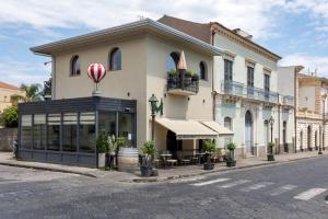 a building with a hot air balloon in front of it at Monforte's Etna Loft in Piedimonte Etneo