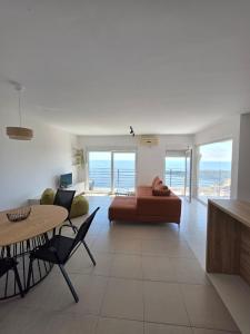 a living room with a couch and a table at Apartman Magdalena in Budva