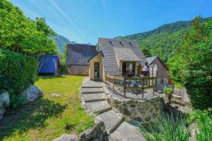 a small house with a stone path leading up to it at Chalet à Aulus-Les-Bains in Aulus-les-Bains
