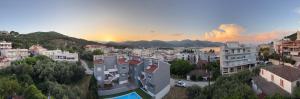 a view of a city with buildings and a sunset at Luxury View in Iraklitsa