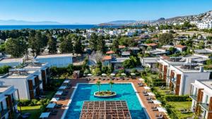 an aerial view of a city with a pool and buildings at Celeste Bella Luxury Hotel & Spa in Bodrum City
