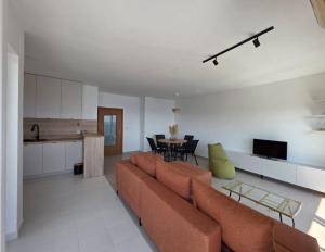 a living room with a couch and a table at Apartman Magdalena in Budva