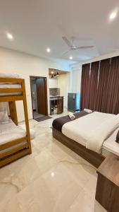a large bedroom with two beds and a kitchen at Sky Pie hotel in Dharamshala +116 photos