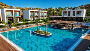an overhead view of a large swimming pool in a resort at Celeste Bella Luxury Hotel & Spa in Bodrum City