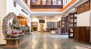 a large room with a statue in the middle at Kathmandu Business Hotel in Kathmandu