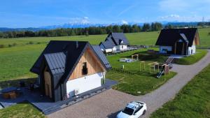 an overhead view of a group of houses in a field at Kącik Na Dolinie in Groń