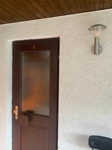 a door with a light on the side of a building at Wappensaal Dhaun in Hochstetten-Dhaun