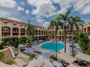 a view of the courtyard of a resort with a swimming pool at Sofitel Legend Santa Clara Cartagena in Cartagena de Indias