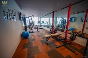 a gym with several equipment in a room at Weekend Retreat- Hotel & Spa in Kurseong