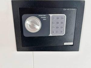 a microwave oven with a remote control in it at Fernblick- Sauna- WLAN- Haus 2 in Neheim-Hüsten
