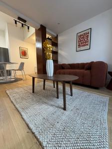 a living room with a couch and a coffee table at Maison Delayant in La Rochelle