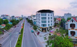 an empty street in a city with buildings at Lumia Hotel Vinh Yen in Vĩnh Phúc