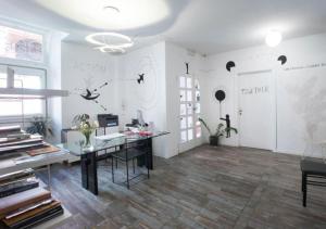 an office with a desk in a room at Boutique Hotel Novecento in La Spezia +49 photos