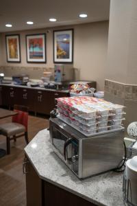 a kitchen with a counter with trays of food at Rapid River Lodge in Baxter