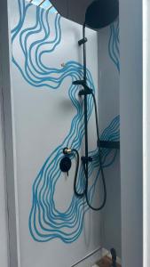 a room with a door with a painting on the wall at Amurg Glamping&Pool in Vadu