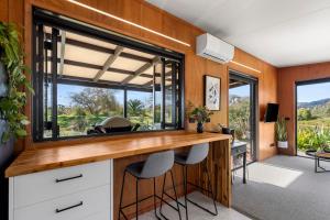 a home office with a desk and two stools at Relaxing Getaway in Pohara in Pohara