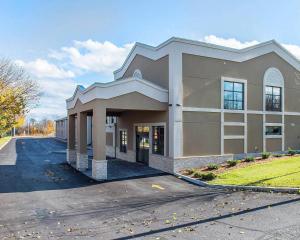 a large building on a street with a road at Comfort Inn in Brockville