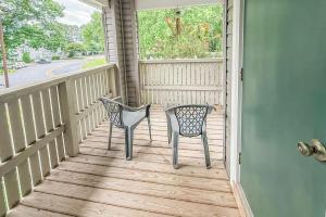 a pair of chairs sitting on a porch at Nyakio Suite in Chesapeake