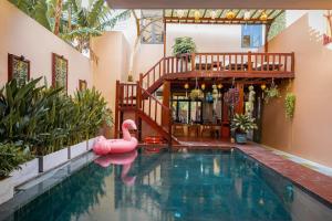 a swimming pool with a pink swan in a house at Sola Hoi An in Thanh Ðông (1) +30 photos