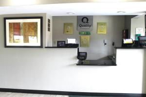 a waiting area at a quality clinic with a cash register at Quality Inn McComb in McComb +11 photos