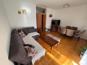 a living room with a couch and a table at Apartman Ana in Trebinje
