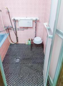 a pink bathroom with a shower and a toilet at 和庵-Nagomian- in Kasaoka +38 photos