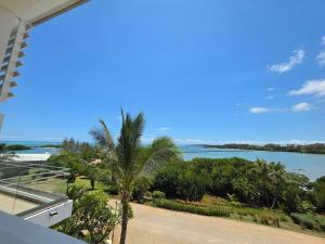a view of the water from the balcony of a house at Oceanfront in Azuri in Roches Noires