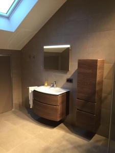 a bathroom with a sink and a mirror at Le Pot de Miel d'Ugny in Ugny +28 photos