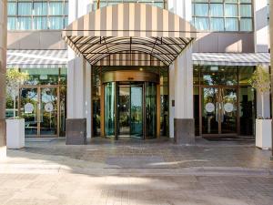 an entrance to a building with revolving doors at Novotel Melbourne Glen Waverley in Glen Waverley