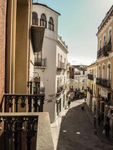 a view of an alley from a balcony of a building at Hotel Gran Plaza in Córdoba