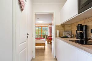 a kitchen with a sink and a counter top at Auszeit am Fluss - Donau in Obernzell