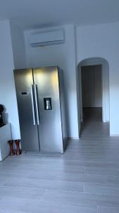 a large stainless steel refrigerator in a room at Casa Flavia in Lierna