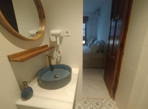 a bathroom with a sink and a mirror at Casa Medusa fun in Cullera +32 photos