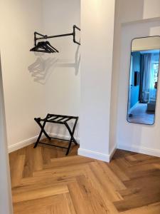 a room with a table and a mirror on the wall at Westerntor City Studio in Paderborn
