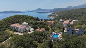 an aerial view of a resort and a lake at Villa Verra in Pržno