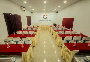 a row of tables and chairs in a room at Strand Resort in Lonavala +40 photos