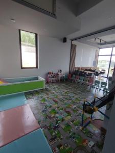 a room with a floor covered in lego furniture at Meandri in Nova Varoš