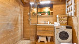a bathroom with a washing machine and a washer at Villa Velika by Villas Guide in Pisarovina +26 photos
