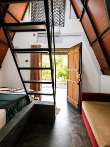 a room with stairs leading to a room with a door at Pahana village Sigiriya in Sigiriya +34 photos