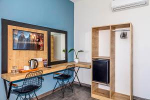 a kitchen with a table and chairs in a room at Dedem Hotel Express-İstanbul Airport-Round Trip Airport Service in Arnavutköy