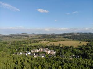 an aerial view of a large house in the trees at Ferienwohnung Brilon - Willingen in 10min in Brilon